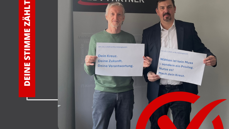 Die Geschäftsführer der EDV-PARTNER GmbH stehen im Zentrum einer digitalen Illustration, die die Bedeutung der Bundestagswahl betont. Sie halten Schilder mit den Aufschriften: ‚Dein Kreuz. Deine Zukunft. Deine Verantwortung.‘ und ‚Wählen ist kein Muss – sondern ein Privileg. Nutze es! Mach dein Kreuz.‘